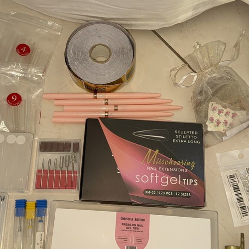 Nail products set like new with dual forms, tips, and accessories