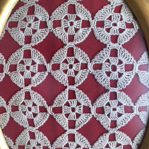 Framed artwork with gold wooden frame and glass used, handmade crochet