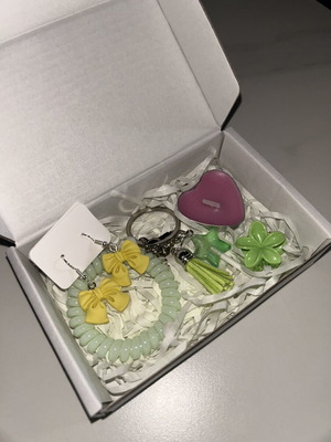 Gift box with earrings, hair tie, keychain, candle, and flower clip new