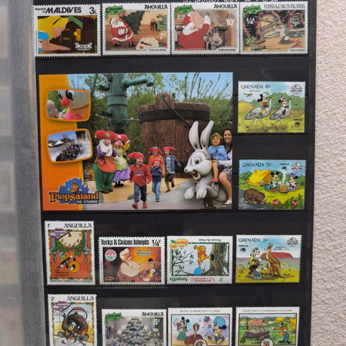 Disney collectible album with 220 stamps and 16 cards