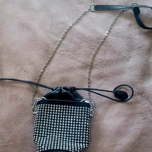 Shoulder bag like new, small black with shiny silver ornaments