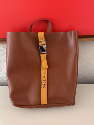 Nolah Backpack like new, brown with yellow strap