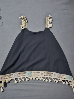 Black sleeveless top in boho style
