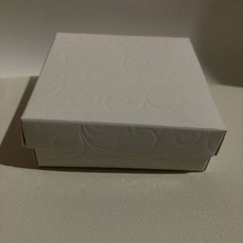 Silver bracelet with pink hearts in a box