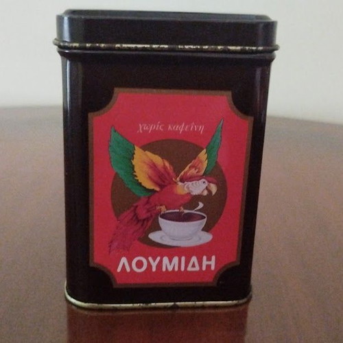 Collectible metal Loumidis Papagalos Greek coffee tin used