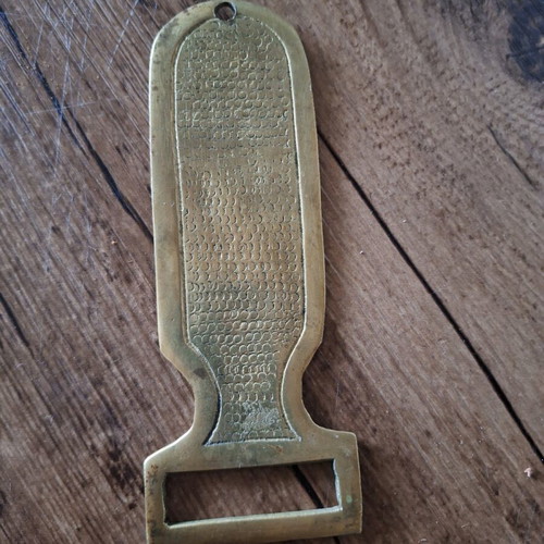 Brass bottle opener with Egyptian hieroglyphs used, 15 cm
