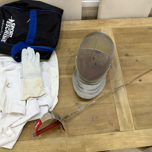 Fencing accessories used, helmet, sword, vest and bag
