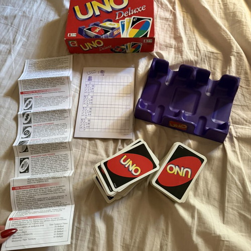 Uno Deluxe card game used with base and score notebook