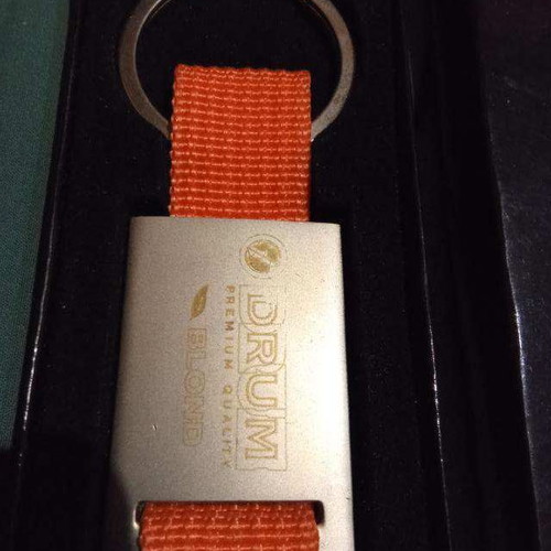 Drum keychain like new, silver and orange