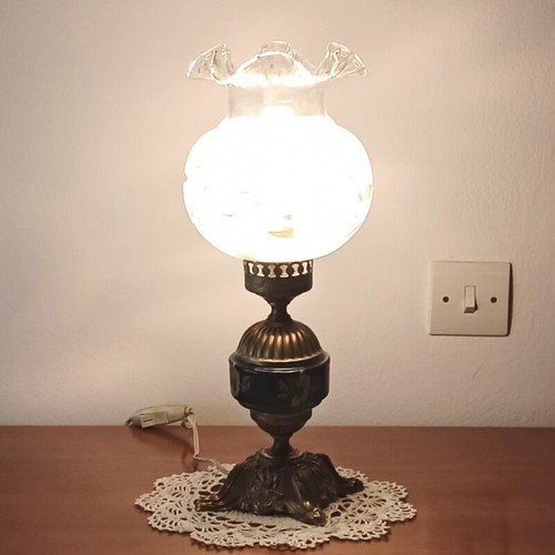 Vintage table lamp with glass shade and decorative metal base used
