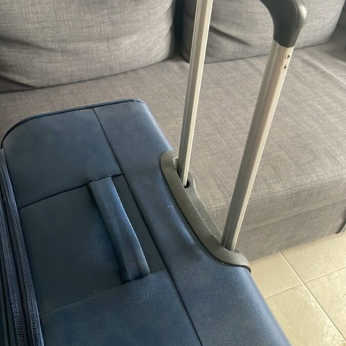 Large suitcase like new, blue, with 360-degree wheels and lock system