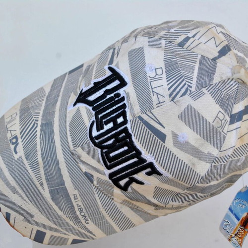 Billabong beige hat used with logo and graphic print