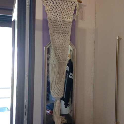 Two knitted wall hangers for pots, different sizes