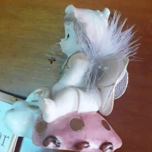 Vintage porcelain figurine Trimar baby angel on snail, like new