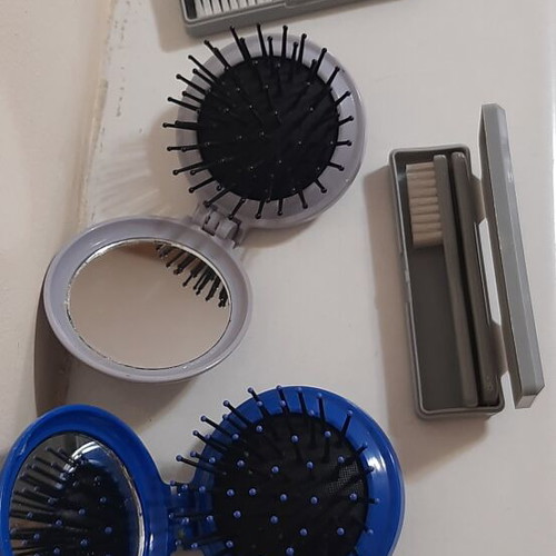 Travel set with 2 hairbrushes with mirror and 2 toothbrushes new