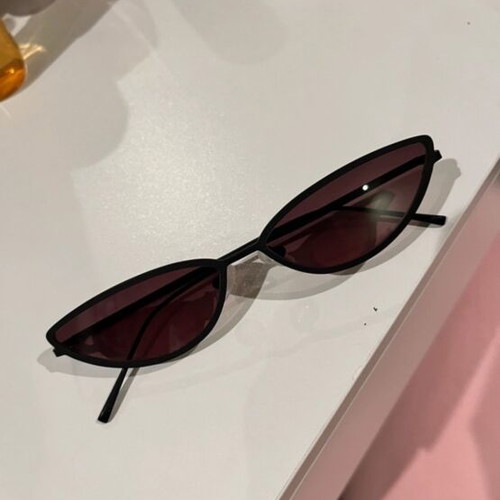 Sunglasses new with thin black frame and pink lens