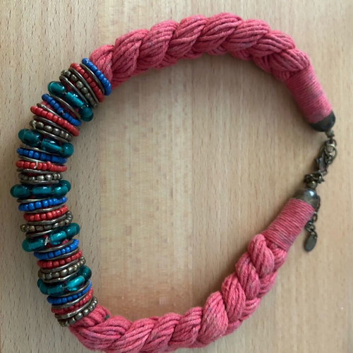 Red braided necklace with multicolored stones used
