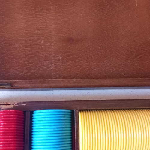 Poker chips in wooden box used