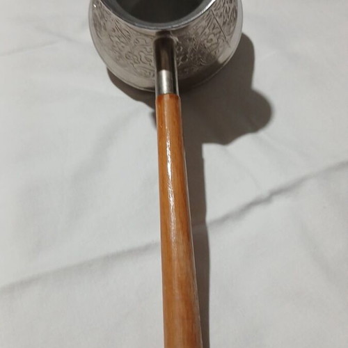 Traditional copper briki with embossed designs and wooden handle, like new