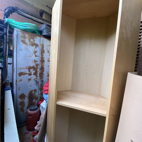 Polygonal beech-colored bookcase used, adjustable shelves