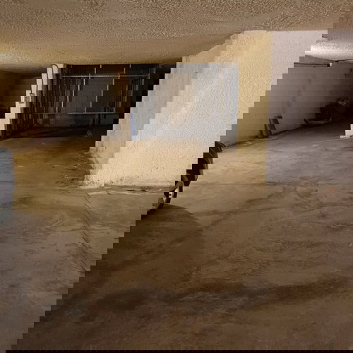 Underground parking space with car elevator, Athens Three Bridges