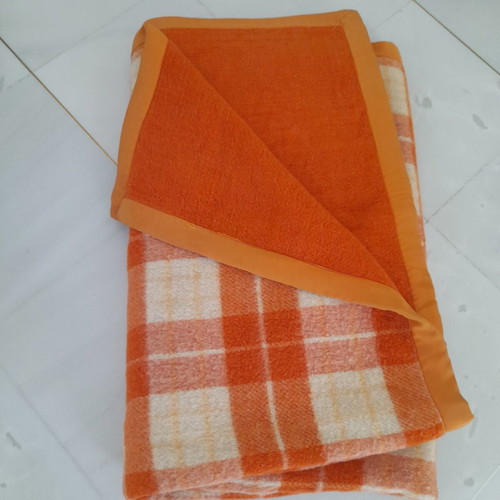 Wool blanket used, orange checkered bicolor