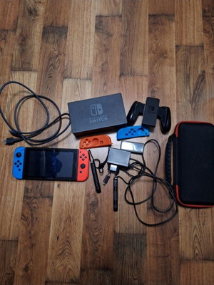 Nintendo Switch red and blue used with accessories
