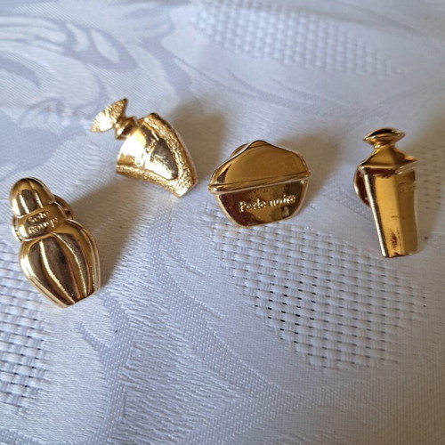 Avon collectible pins set of 4, like new, French perfumes