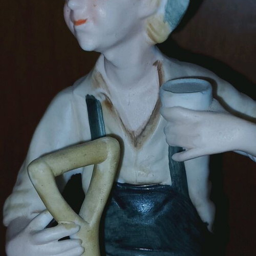 Decorative figurine like new with boy farmer and shovel