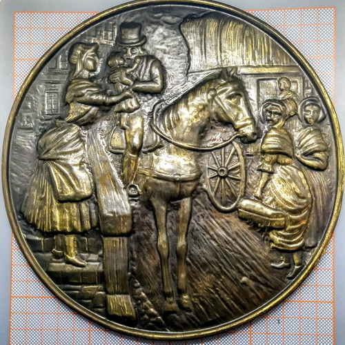 Vintage round brass plate used with embossed scene