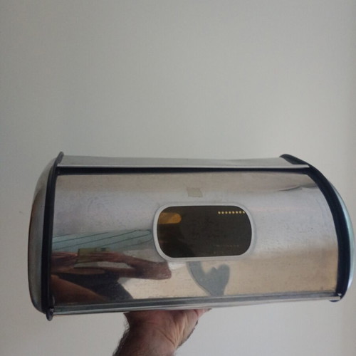 Metal bread box with two dents