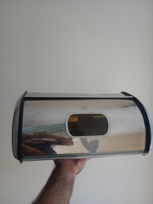 Metal bread box with two dents