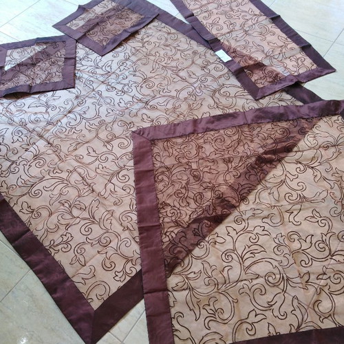 Tablecloth set of five pieces iridescent dark brown, silk organza with embossed flowers and border