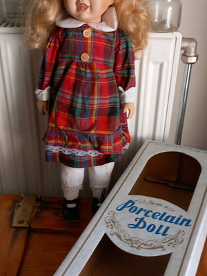 Porcelain doll collectible with original box