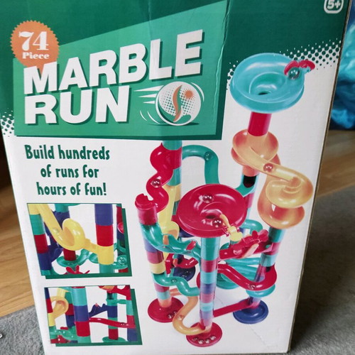 Marble run toy used with its box