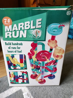 Marble run toy used with its box