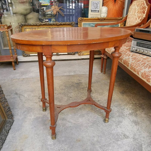 Vintage oval wooden coffee table used with brass feet