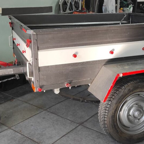 Trailer bag carrier used with removable and folding plywood lid