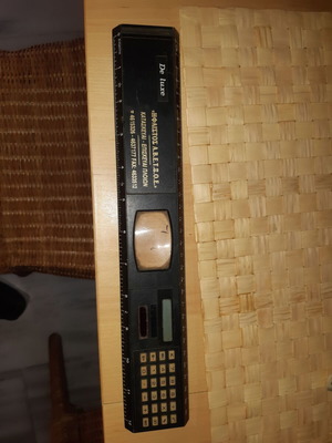 Vintage promotional ruler multitool with magnifier and used calculator