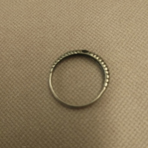 Silver ring with embossed ribbed design used