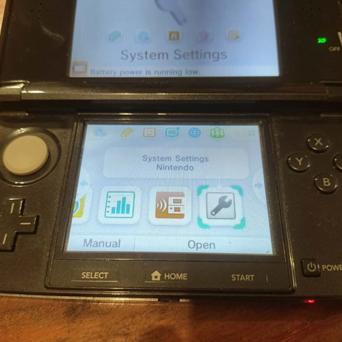 Nintendo 3DS console with charger, memory card and stylus