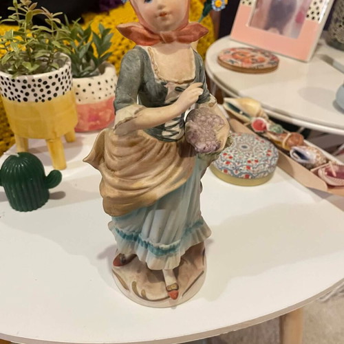 Porcelain decorative figurine of a girl with matte finish like new