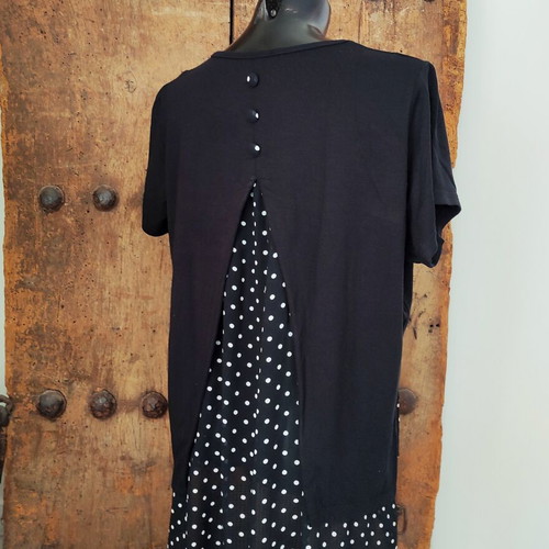 Women's black T-shirt with polka dot chiffon open back and button detail