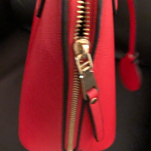 Red handbag used with wear marks