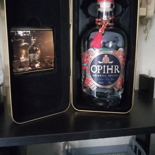 Metal Bottle Case like new with collectible bottle