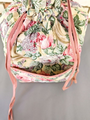 Vintage fabric drawstring bag with floral pattern
