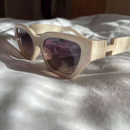 Sunglasses new, beige with metal decoration