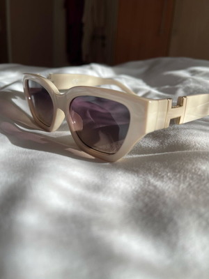 Sunglasses new, beige with metal decoration