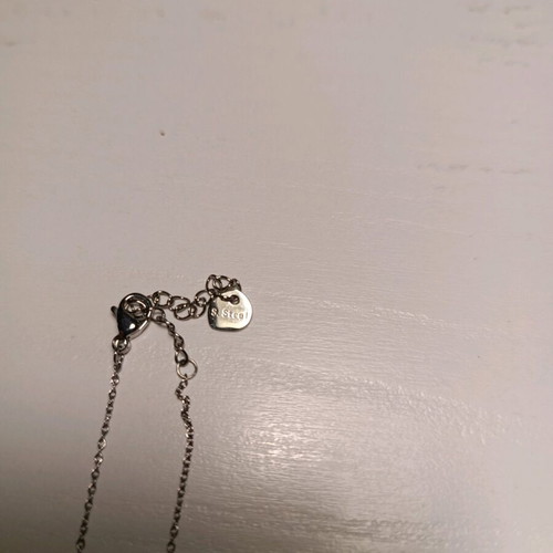 Stainless steel necklace like new with red and silver details