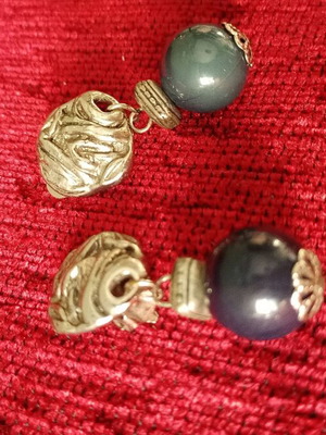Earrings with clip and embossed wave design used, black and gold